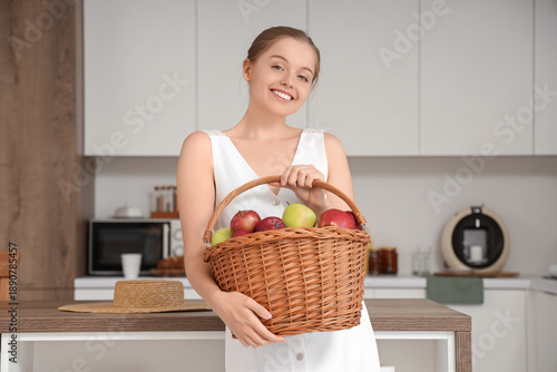 Smiling young woman holding...