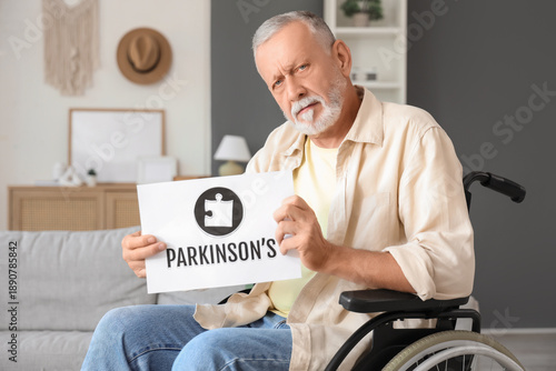 Senior man in wheelchair ho...