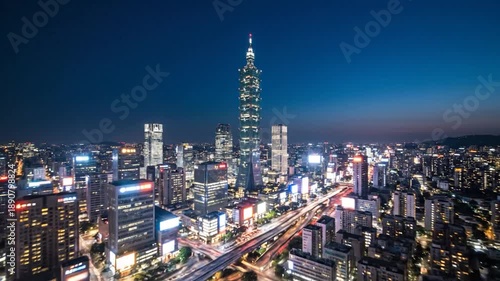 Wallpaper Mural A modern skyscraper dominates a glowing cityscape at twilight Torontodigital.ca
