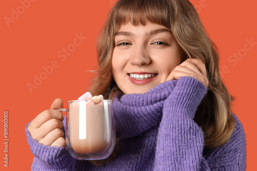 Pretty young woman holding ...