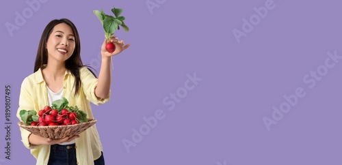 Young Asian woman holding b...