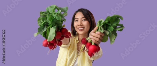 Young Asian woman holding r...