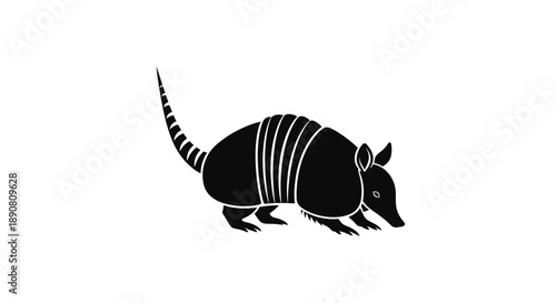 Black silhouette of an armadillo with segmented armor and tail.