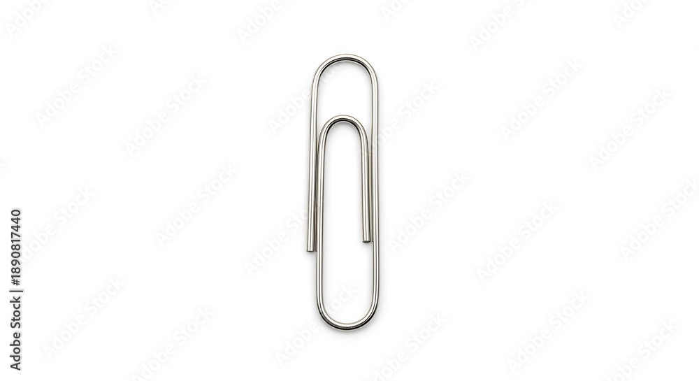 Obraz premium Close-up studio shot of a shiny silver metal paperclip on a crisp white backdrop