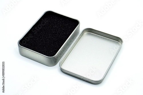 Billede på lærred Opened metal tin rectangle box storage case with lid isolated on horizontal white background