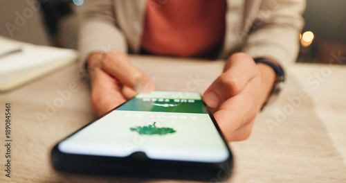 Fotografie Phone screen, eco website and hands at desk, sustainability promotion or green business homepage