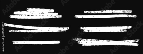 Grunge white brush strokes and paint marks on black background. Rough textured lines and distressed ink swashes for artistic design. Ideal for posters, banners, overlays, backgrounds, and modern graph