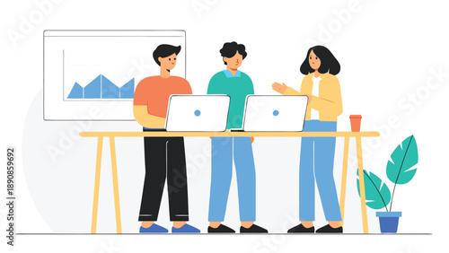 Three young professionals collaborating on laptops at a wooden desk with a graph