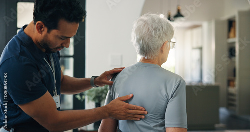 Photos Old woman, chiropractor and back exam in nursing home with support, wellness and rehabilitation