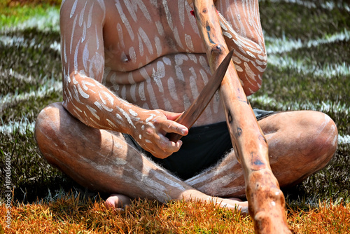 Photos Indigenous Australians man play Aboriginal music with didgeridoo wind instrument