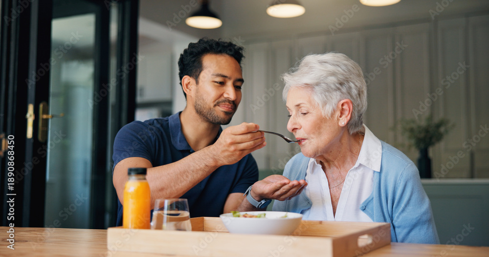 Fototapeta premium Nurse, man and feeding breakfast with old woman for assisted living, support or nutrition at house. People, caregiver and helping hand with elderly patient, meal and food for diet at nursing home