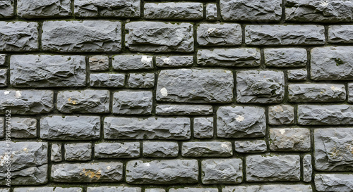 Grey stone brick wall texture background.
