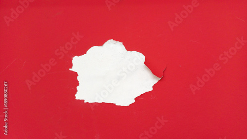 Wallpaper Mural Torn hole in red paper revealing white background underneath. Minimalist conceptual image for message reveal, discovery, hidden secret, and creative advertising space. Torontodigital.ca
