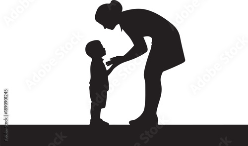 Silhouette of and child interacting closely together