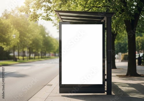 Blank vertical billboard mockup on city bus stop shelter at sunny street