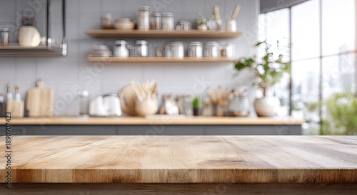 Warm, sunlit modern kitchen with empty wooden table in foreground