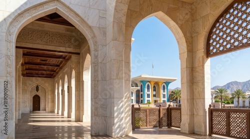 Ornate White Marble Arches Leading to Colorful Palace Facade Under Blue Sky