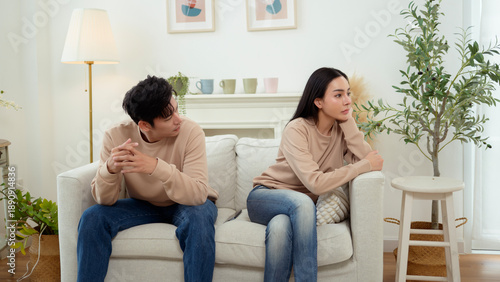 Quarrel Between Asian Couple Revealing Issues of Infidelity and Emotional Distance in a Cozy Setting