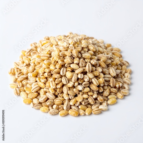 Pile of pearled barley grains against a clean white backdrop, illuminating its textured surface