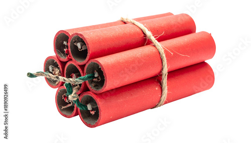 Bundle of red cylinders with exposed fuses and tied with twine against a dark background