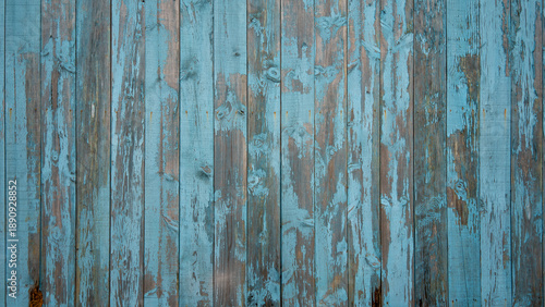 Foto Old blue painted wooden planks with peeling paint texture, ideal for rustic back