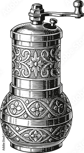 Vintage ornate metal pepper grinder with floral patterns and crank handle