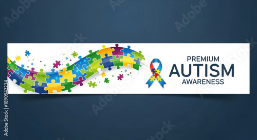 Autism awareness ribbon with colorful puzzle pieces on white background
