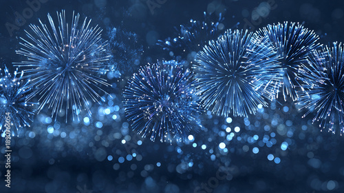 A dazzling display of blue fireworks exploding in the night sky, creating a vibrant and festive atmosphere.