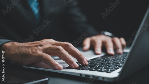 Foto Close-up of hands typing on a laptop keyboard