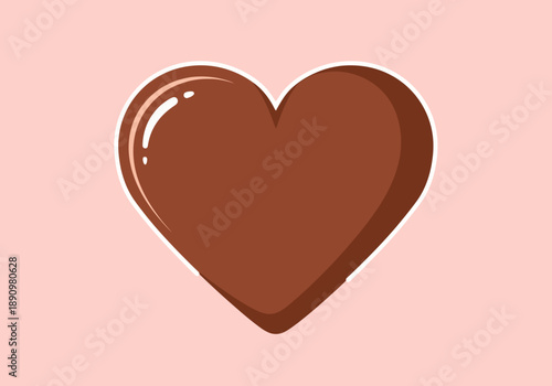 A chocolate heart-shaped sweet treat on a pastel pink background viewed from directly above