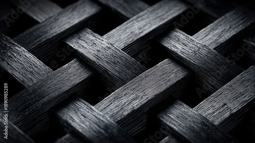 Intricate dark woven metallic threads forming a complex abstract geometric pattern