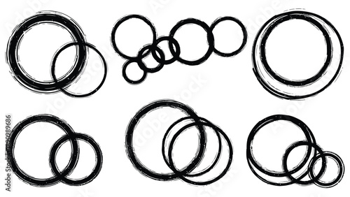 Black rubber o ring seals in various sizes and arrangements on white background for industrial use