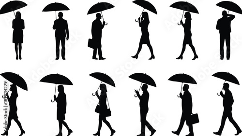 A group of business people walking with umbrellas in silhouette