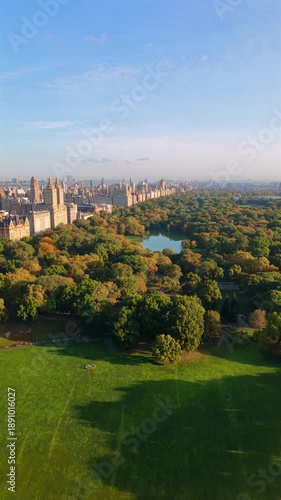 Wallpaper Mural Drone footage shows Central Park surrounded by Manhattan towers with autumn trees, calm ponds and dense skyline, capturing cinematic urban nature in New York City, New York, USA.  Torontodigital.ca