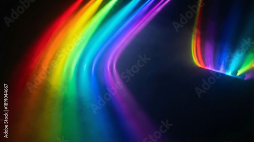 Vibrant rainbow light trails on dark background