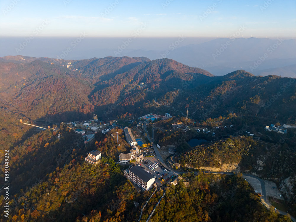 Fototapeta premium Aerial view of mountain resort buildings and roads in Wuhan China during autumn