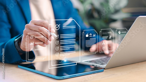 Business professional reviewing and approving digital documents on tablet and laptop with checklist interface. Concept of workflow approval, compliance, audit, e-signature, and business analytics.