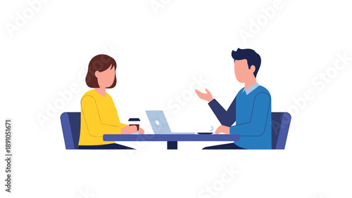 Two business colleagues in discussion at a table with laptop and coffee