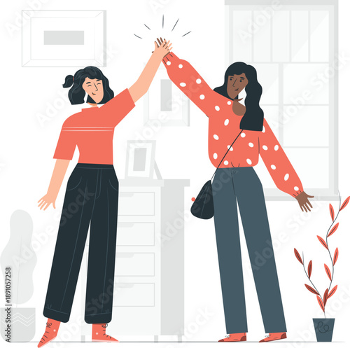 Two women high-fiving in a modern, minimalist living room with a plant and furniture