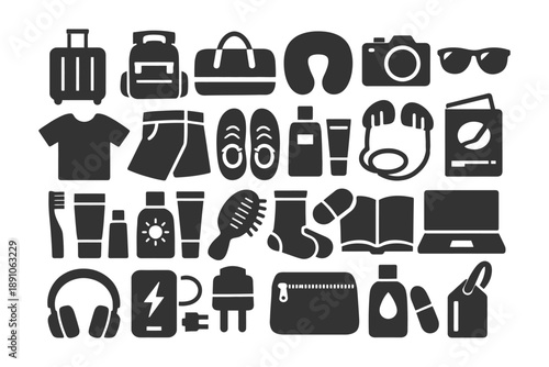Essential travel accessories collection featuring electronics clothing and toiletries.