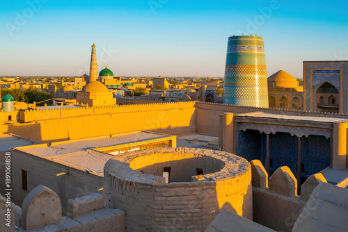 Fotografija High angle view of Khiva old town, Uzbekistan, featuring Kalta Minor minaret at sunset