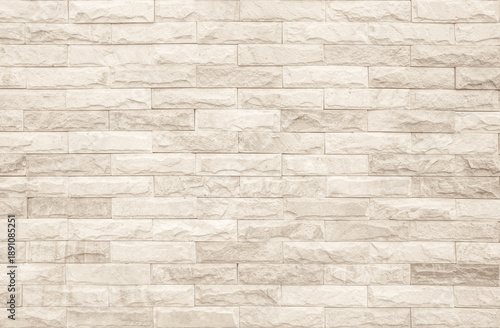 Cream and white brick wall texture background. Brickwork and stonework flooring interior rock old pattern clean concrete grid uneven bricks design stack. Background of old vintage brick wall.