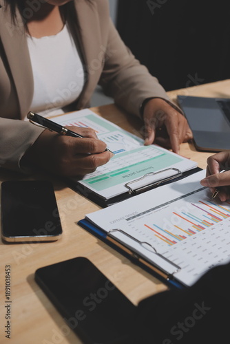 Accounting company provide finance and taxation planning for profitable cash flow, Auditor and accountant team working in office, analyze financial data and accounting record with calculator.Insight