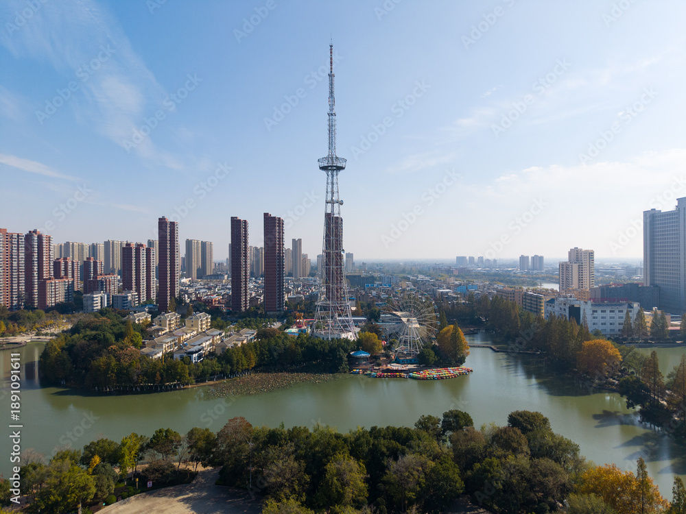 Fototapeta premium Aerial view of Tianmen City, Hubei Province skyline with a prominent tower and river
