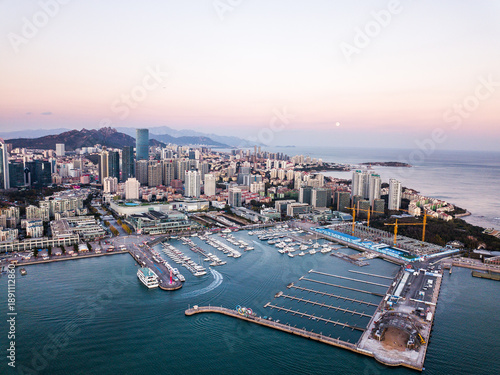 Obraz na płótnie Qingdao Coastline Aerial View at Dusk with Marina and Skyline