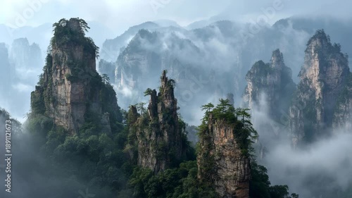 4K Misty landscape of zhangjiajie national forest park, china, featuring towering sandstone pillars and lush green trees shrouded in fog video