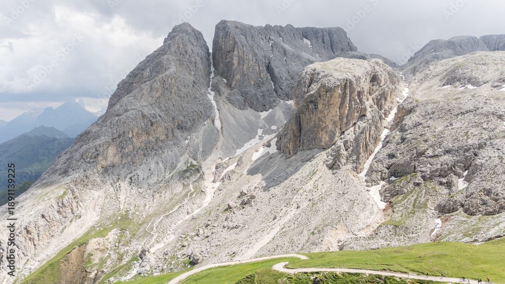 Fototapeta premium Drone view, aerial of surrounding mountains and alpine peaks near Tierser alpl ( Rifugio Alpe di Tires) ,summer day.. Impressive mountains in the background. Schlern-Rosengarten.