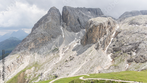 Drone view, aerial of surrounding mountains and alpine peaks near Tierser alpl ( Rifugio Alpe di Tires) ,summer day.. Impressive mountains in the background. Schlern-Rosengarten.