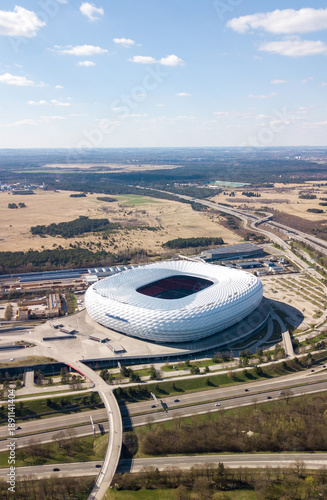 Munich, Germany - April 04, 2021: Drone flight over Football stadium Allianz Arena at sunny day