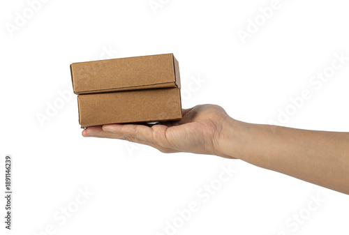 Wallpaper Mural Small brown cardboard box in hand on a transparent background. Torontodigital.ca